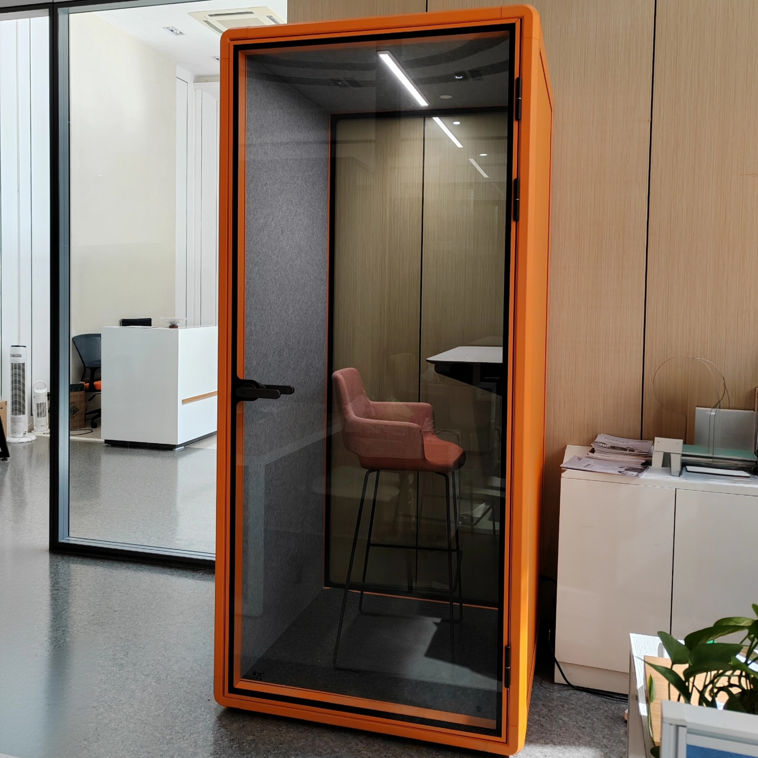 Orange single person phone booth